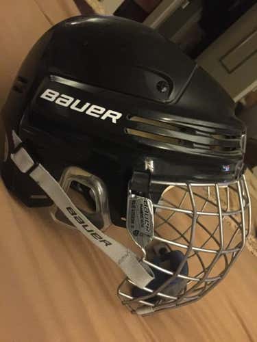 Bauer hockey helmet with cage size large