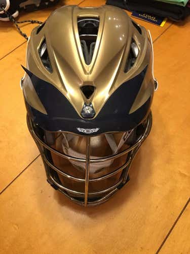 Gold pro 7 lacrosse helmet with gold chrome cage