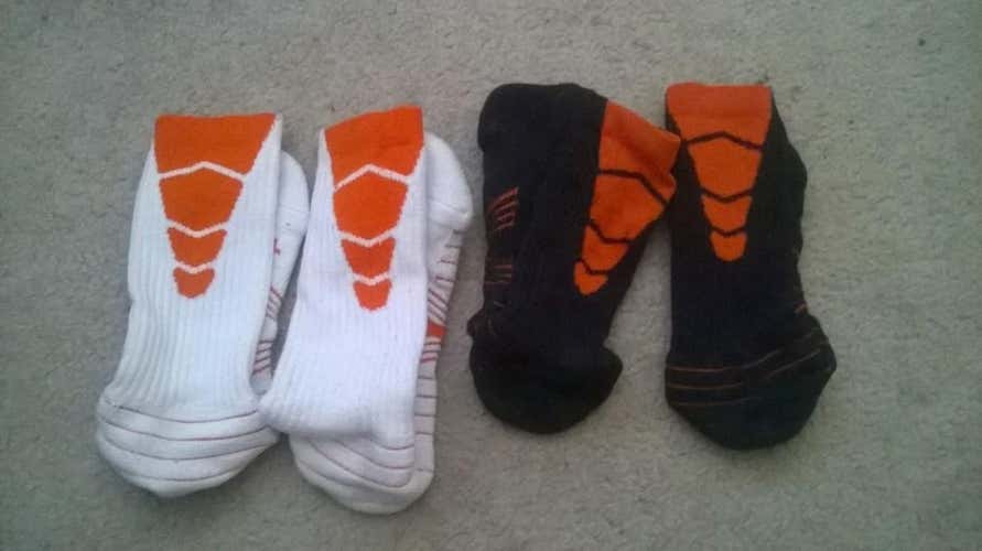 orange, black and white Nike vapor elites