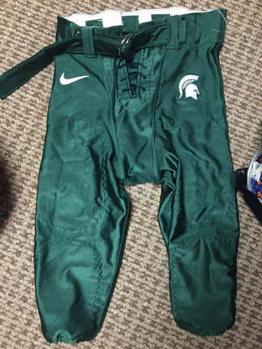 Green Michigan state used football pants