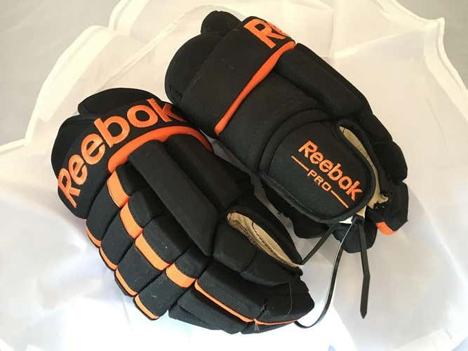 Like new Reebok pro black/orange gloves 14"