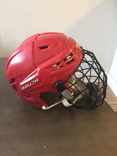Cornell Team Issued Bauer 8500 large helmet with profile II cage.
