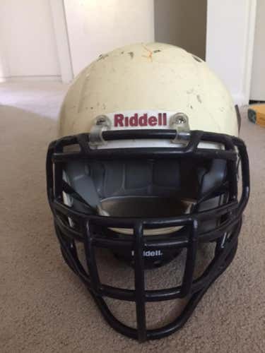 White riddell revolution speed helmet with blue lineman facemask