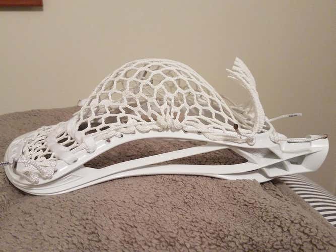 Nike CEO. Strung with string king 3x kit. Strung with SI knots on sidewalls.