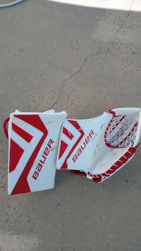 White/Red Bauer Supreme One.9 Senior regular blocker and trapper.