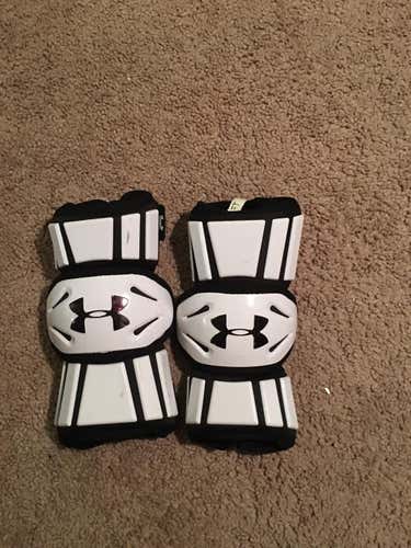 White Under Armour lacrosse pads