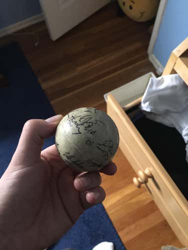 Paul Rabil signed lax ball along with other Hopkins teammates