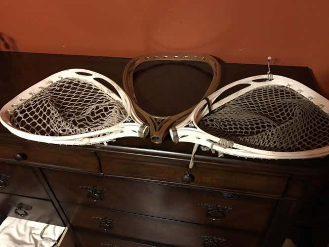 Three cracked goalie heads