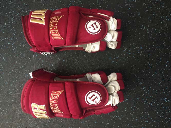 Pro stock hockey gloves designed specifically for university of Denver! These gloves are size 14!