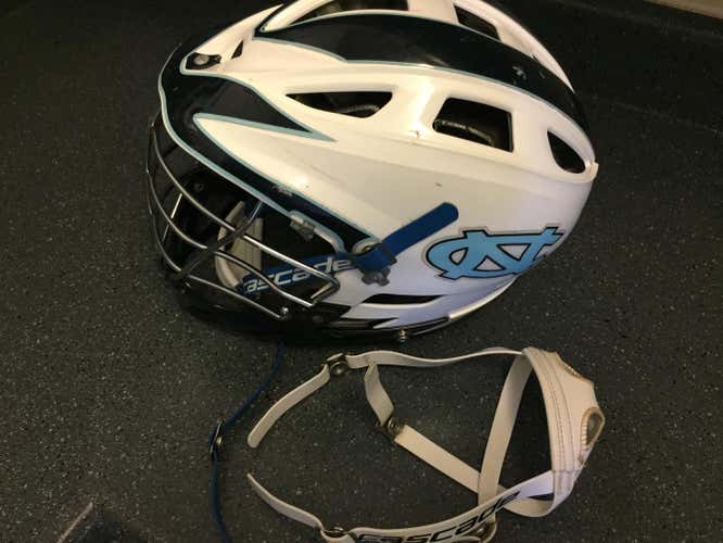 Used UNC Carolina Cascade Pro 7 White Helmet Black Facemask/Chin with Blue and White Chin Straps