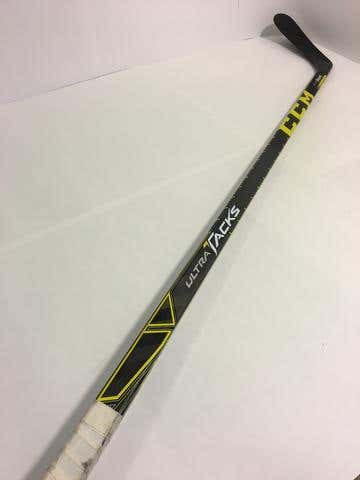 871 - USED LEFT HANDED CCM ULTRA TACKS - 85 FLEX - P90 CURVE - GRIP - 64" TALL STANDING UP AGAINS...