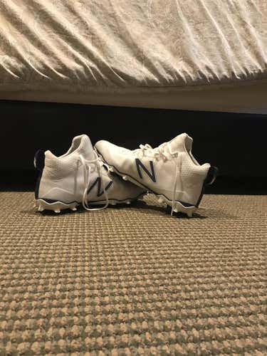 New Balance white and blue cleats