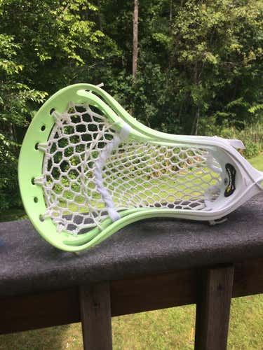 Neon green dyes Easton head strung up with semi soft mesh in mid low pocket
