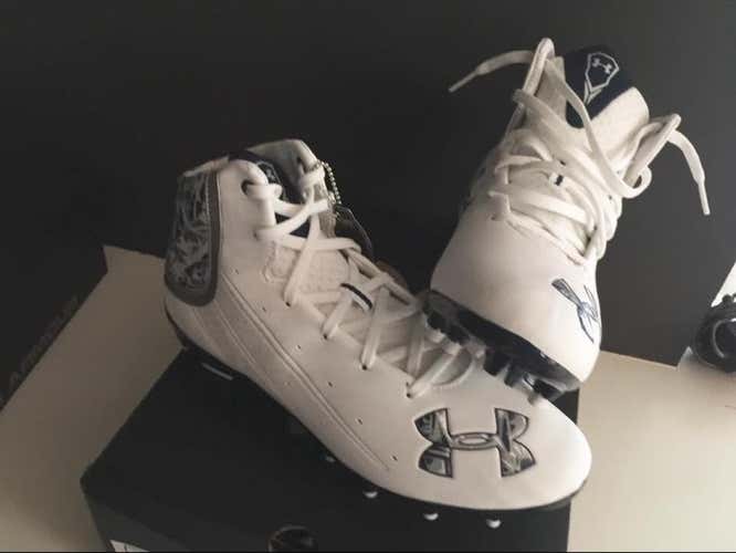 Two Pairs Of Under Armor Cleats