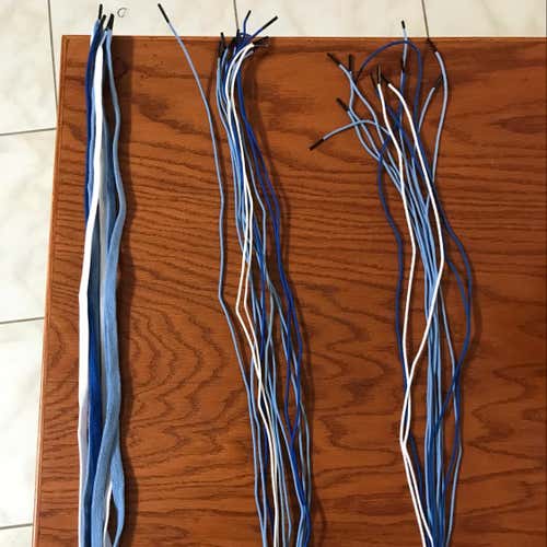 Assortment Of Hero Strings In Carolina Blue, Royal Blue, And White.