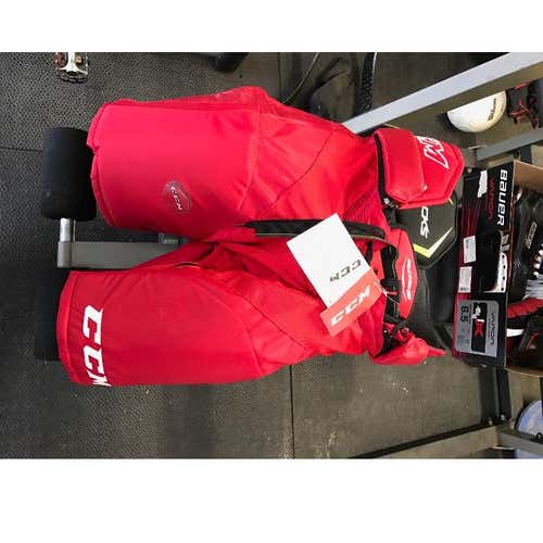 Brand New Pair of Red Ccm Tack 6052