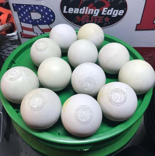 24 Used Signature Lacrosse Balls, smooth and discolored on parts of the balls