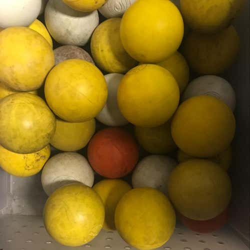24 Horrible Condition Lacrosse Balls, some white and some yellow
