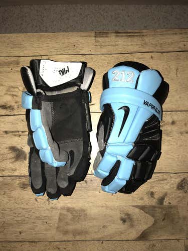 Custom Carolina Blue and Black Nike Vapor Elite Lacrosse 12" Gloves.