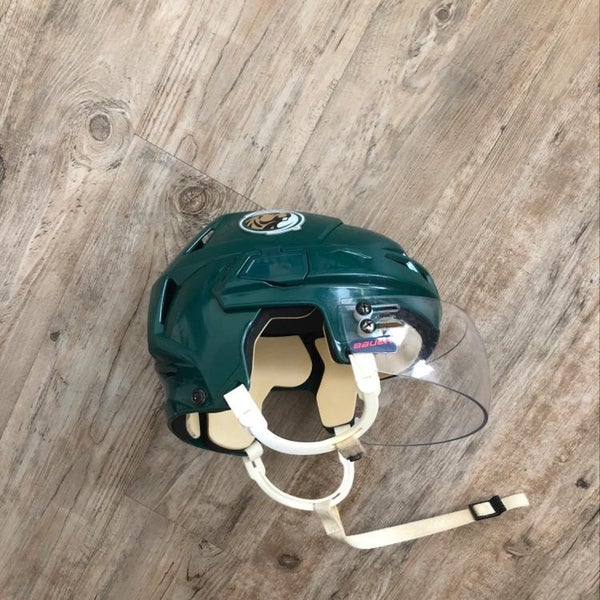 College Hockey Helmet With Bauer Visor On It