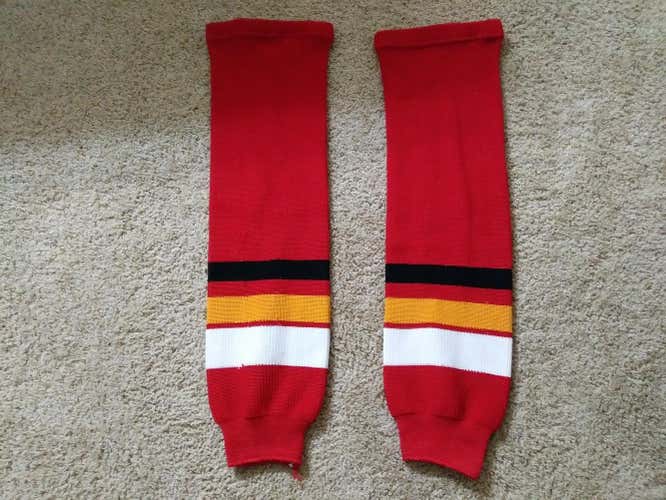 Athletic Knit Calgary Flames (?) Socks Red, white, black, and yellow