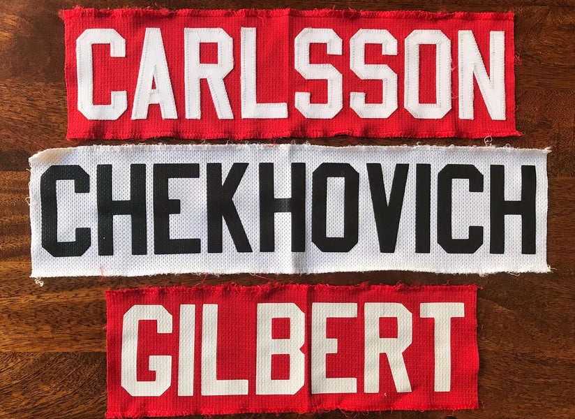 Pre-made Reebok EDGE nameplates. White and Red. From the Chicago Blackhawks
