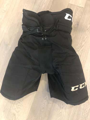 Used CCM HP30 (MED)  Pro Stock Hockey Pants Black ,   (P77)