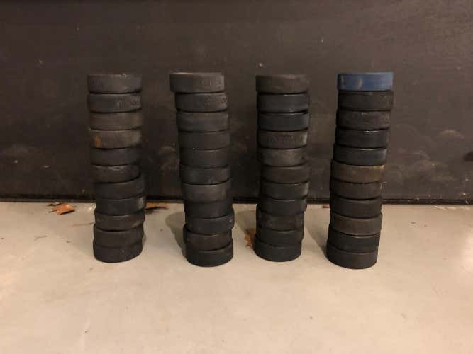 50 Hockey Pucks EACH ONE IS 1$