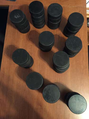 55 Hockey Pucks
