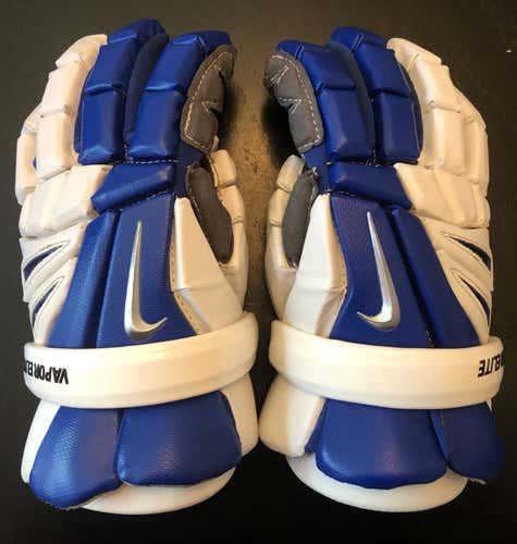 Very lightly used Nike Vapor Elite 2 Gloves. Royal Blue & White. Size 13. No Holes. No stink.