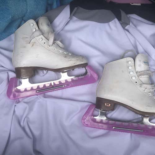 RIEDELL Girls youth white figure skates with blade guards.