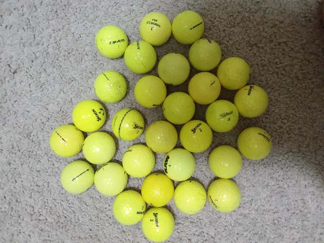 30 yellow golf balls. Assorted brands