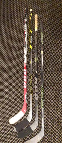 4 used CCM hockey sticks