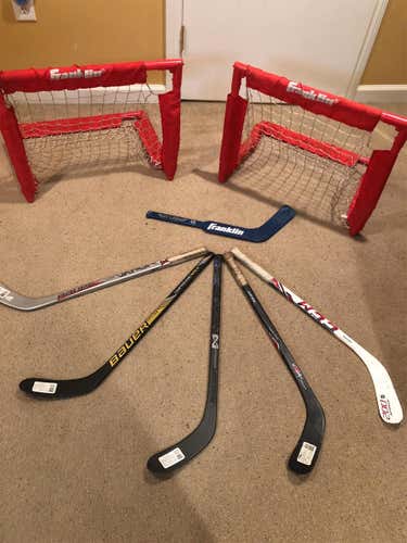 Haul Of 5 Knee Hockey RH Player Sticks, One Goalie Stick And Two Knee Hockey Nets.