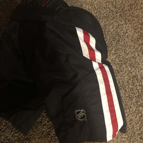 New CCM Chicago Blackhawks Hockey Pants Senior Pro Stock