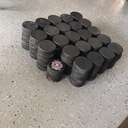 50 Hockey Pucks