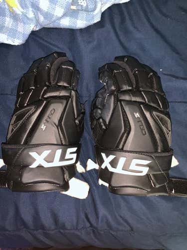 Very Good Condition Size 12 (med) Used STX Cell 4 Lacrosse gloves.