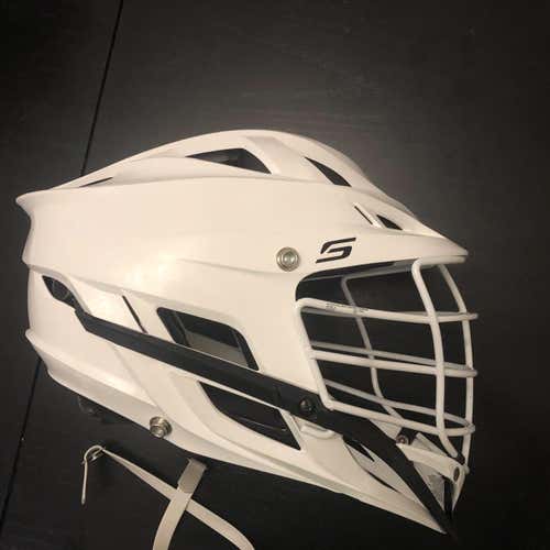 Used Cascade S Helmet. White Shell, White Cage, White chin And Strap. Adult