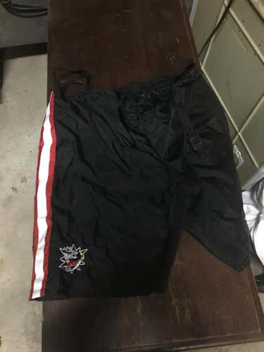 New CCM Red and black striped goalie shell never used