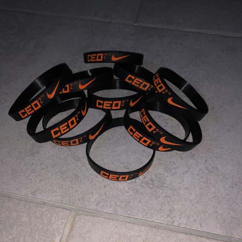 2 NIKE LACROSSE BRACELETS (1 Black, 1 Orange)