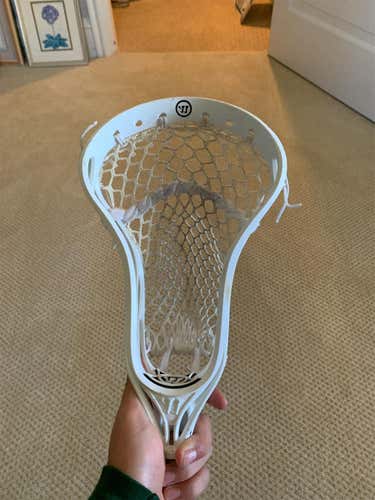Barely used White Warrior Burn lacrosse head- strung