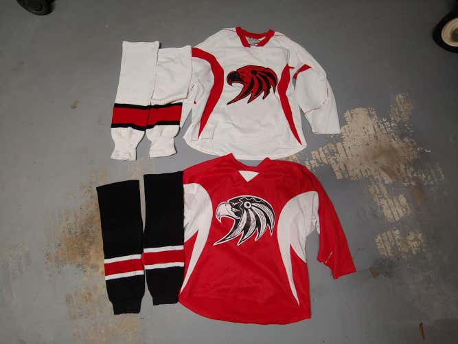 2 hockey jerseys with 2-pairs of socks. XL with Eagle Head and #3. Red and White.