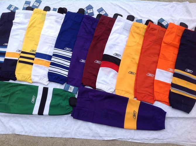 2 New Reebok Socks SX100 Hockey Socks Size So for one Reebok Jr yellow, one Sr black with red/ cream