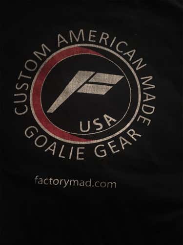 Cool “Factory Mad” goalie gear tee