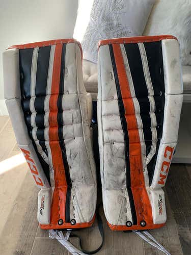 White Black & Orange Intermediate 30+1 CCM Extreme Flex 860 Goalie Leg Pads