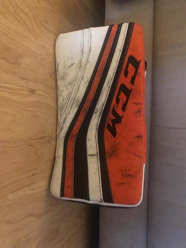 White, Orange, And Black Senior Regular CCM Premier R1.9 Blocker