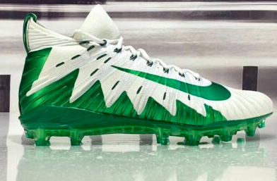 green and white football cleats