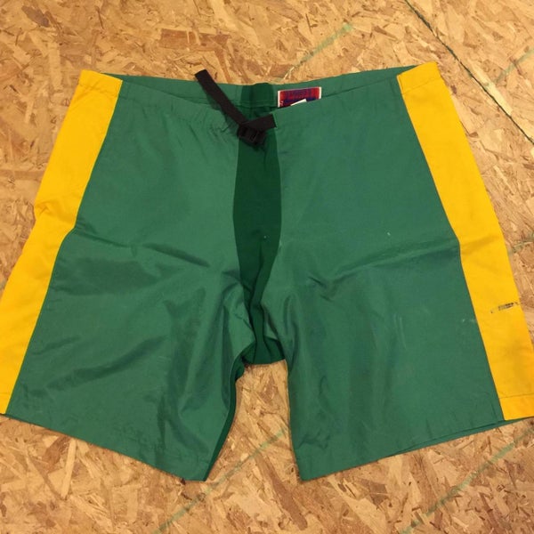 GREEN AND GOLD HOCKEY PANT COVER UPS SIZE MEDIUM