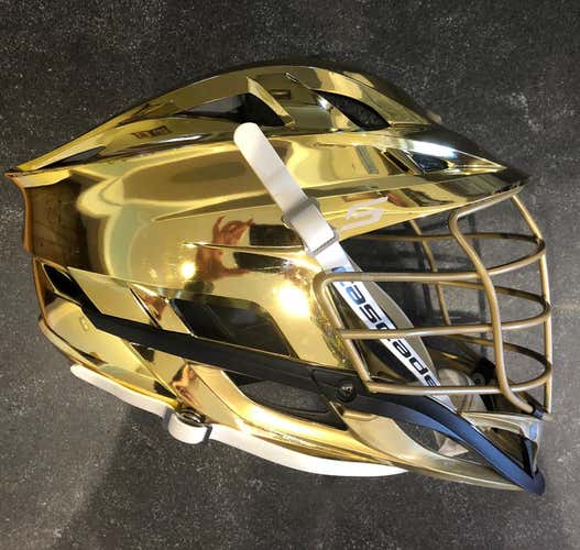 Used Metallic Gold Chrome Cascade S Helmet. Pearl Gold cage & Jaw. White strap.
