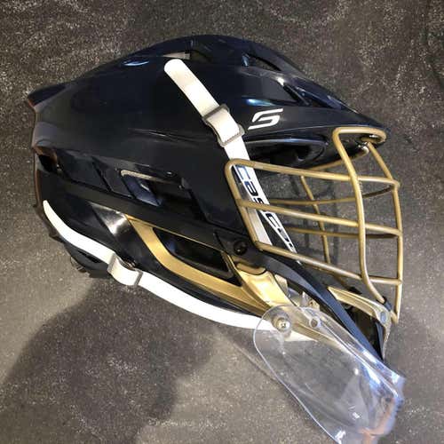 Used Cascade S Helmet With Goalie Throat Protector. Navy Shell, Gold Cage & Jaw, White Strap